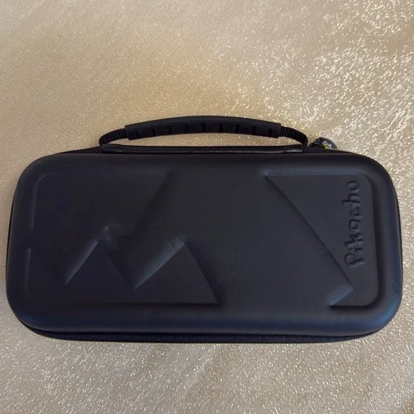 COPY - Pokemon trading card game mat & Nintendo Switch Pikachu case.